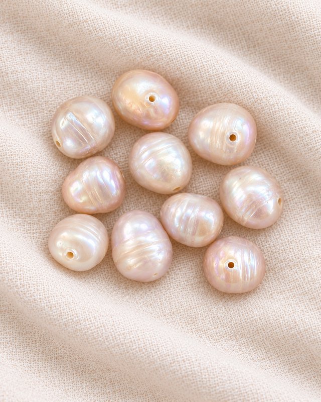 Blush-pink baroque freshwater pearls on cream linen
