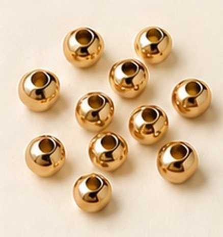 A scatter of round 14K gold-plated beads