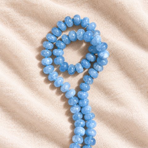 A powder-blue rondelle gemstone strand in a loop