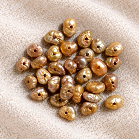 Golden-bronze keshi pearls