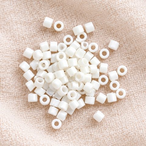 Small matte white tube accent beads